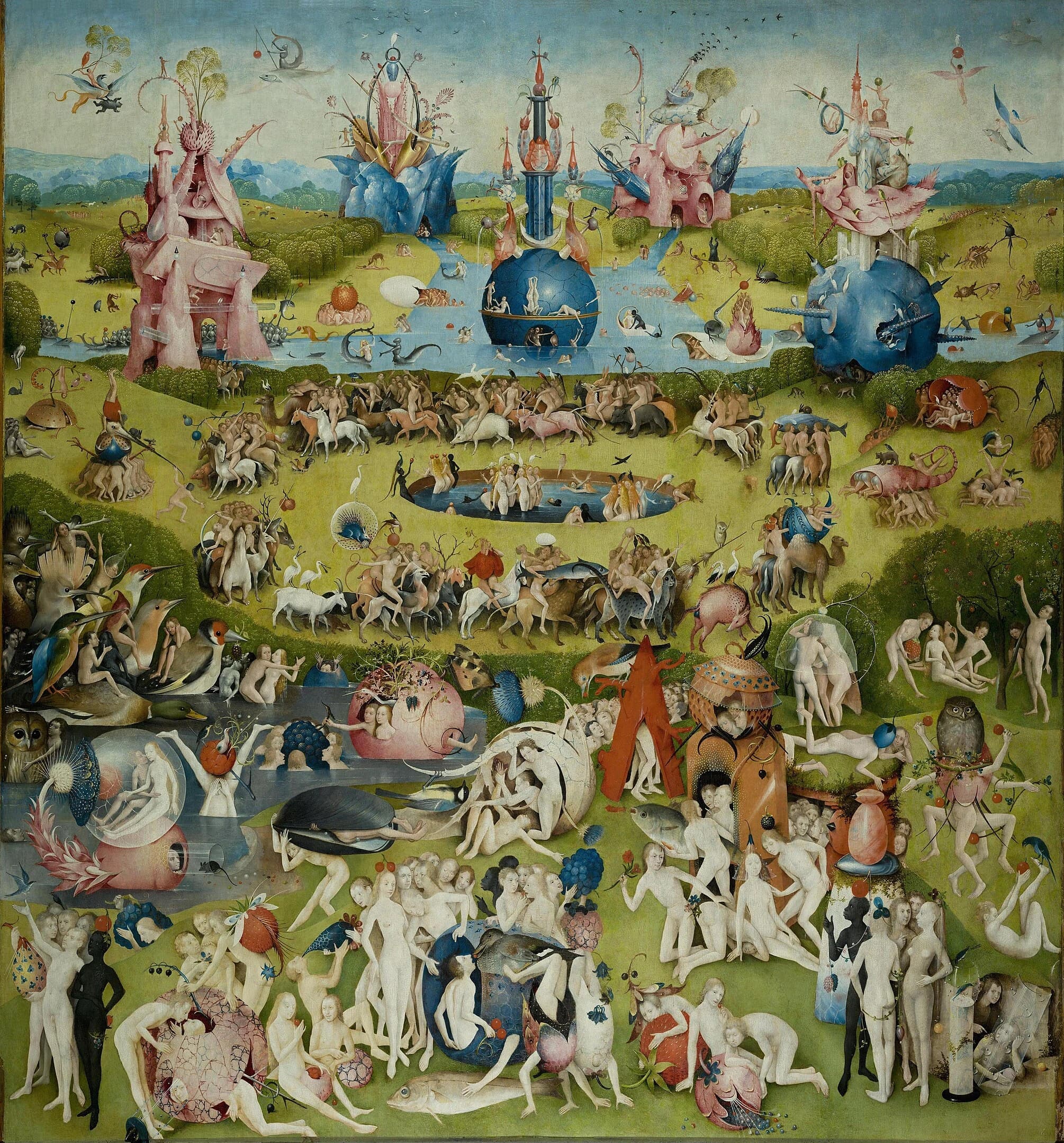 The central panel of Hieronymus Bosch’s The Garden of Earthly Delights, depicting a fantastical, crowded landscape filled with nude figures, oversized fruits, birds, and surreal architectural forms. The scene is bursting with energy and bizarre activity, illustrating a chaotic paradise of pleasure and strange encounters.